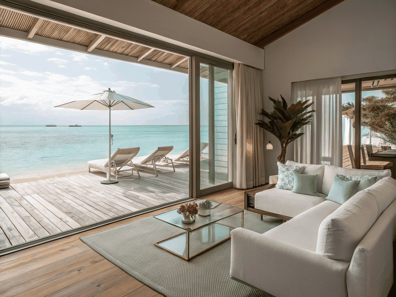 Spacious hotel suite with minimalist coastal decor